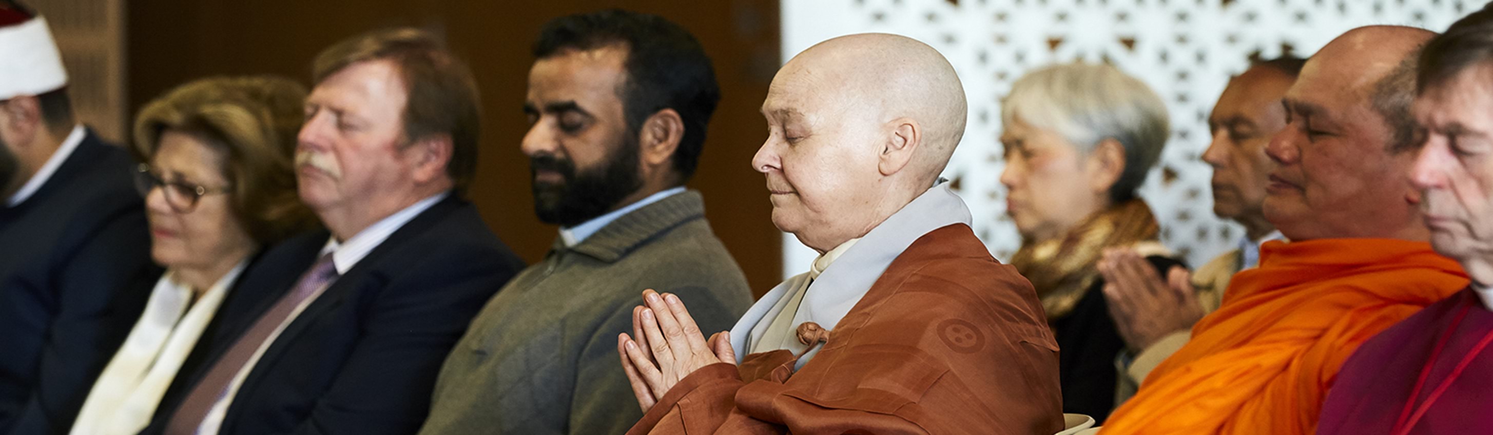 Members of Multifaith Advisory Group praying together