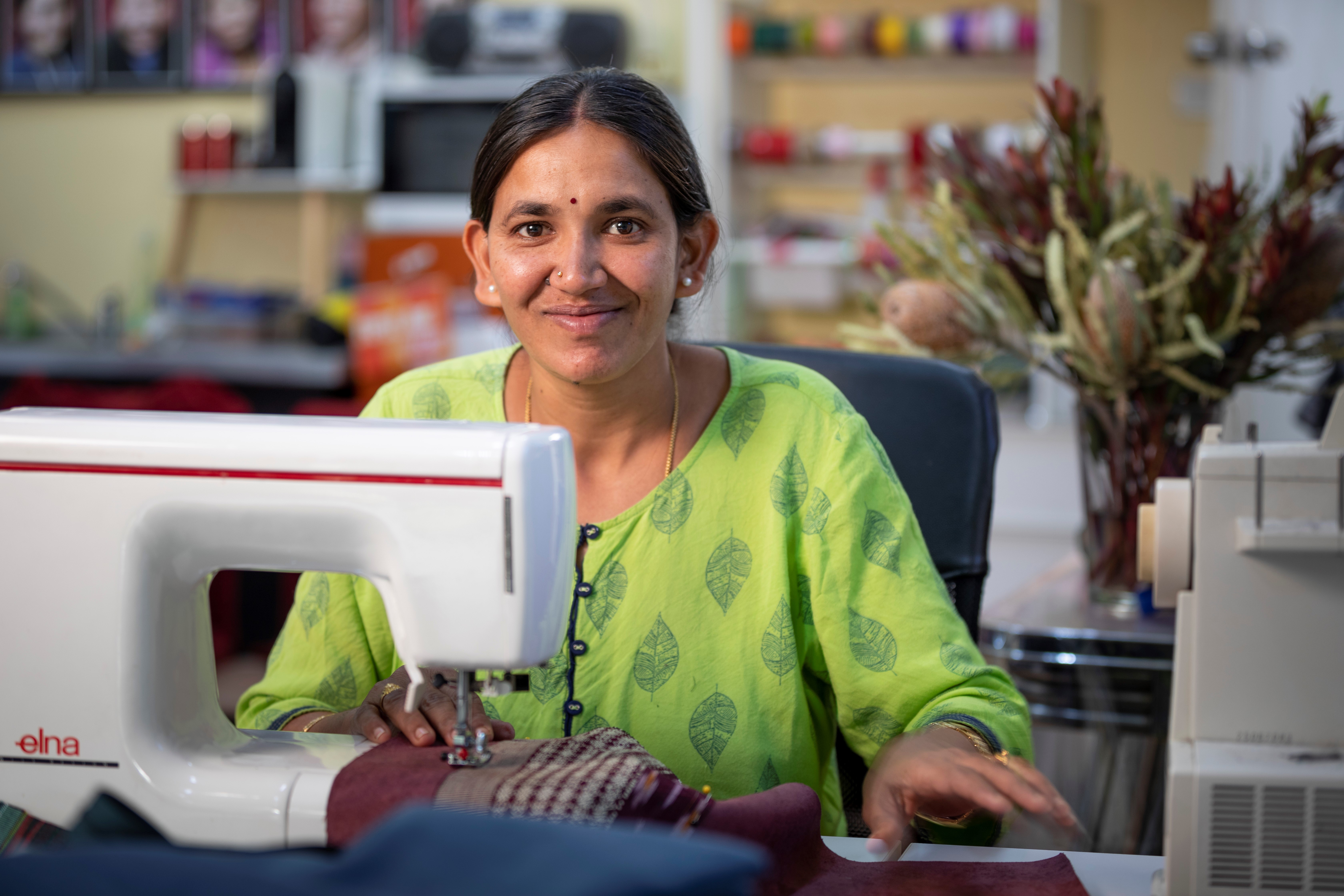 Paw Po Products staff member sewing