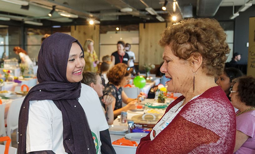 Event attendees at the Welcome Dinner Project 2018 event