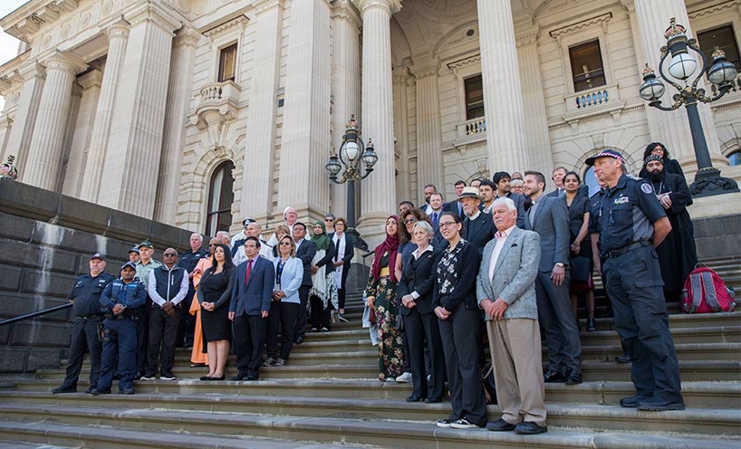 Multifaith and political leaders standing on the steps of Parliament House