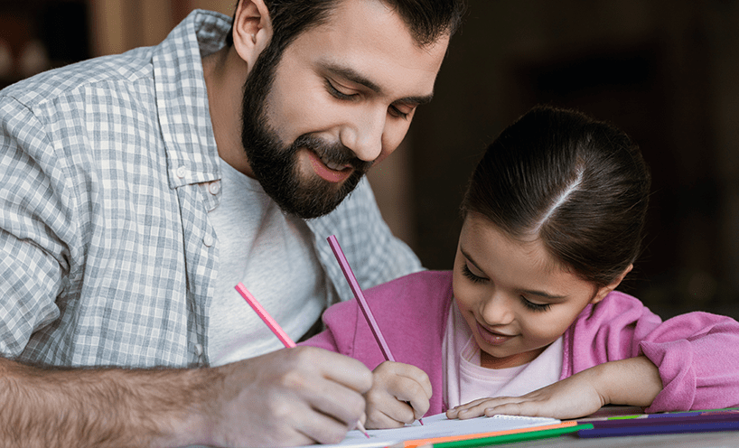 Father and daughter drawing together